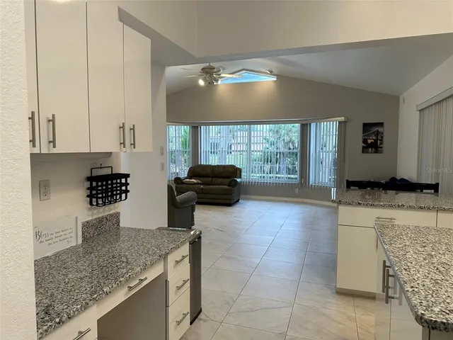 a kitchen with a sink and a counter top space