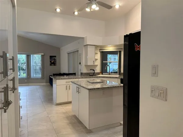 a kitchen with a sink and cabinets