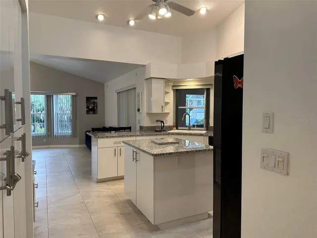 a kitchen with a sink and cabinets