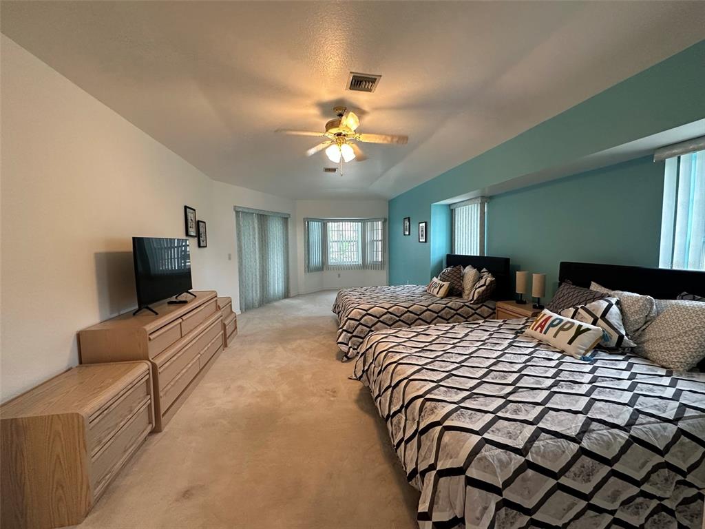 1238 Yorkshire Street Port Charlotte, FL 33952 - Photo 20 of 40 a bedroom with a bed and a television