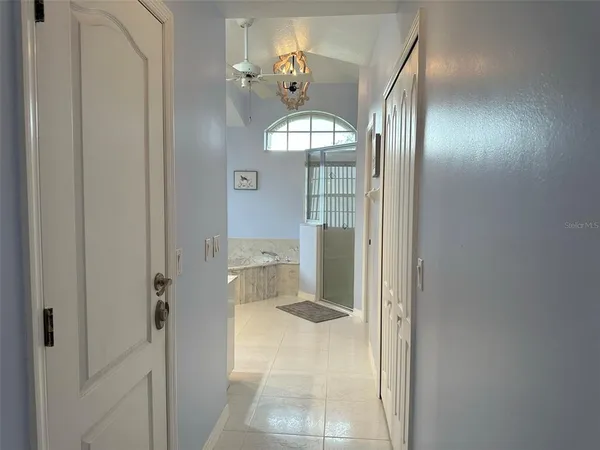 a bathroom with a mirror and a shower