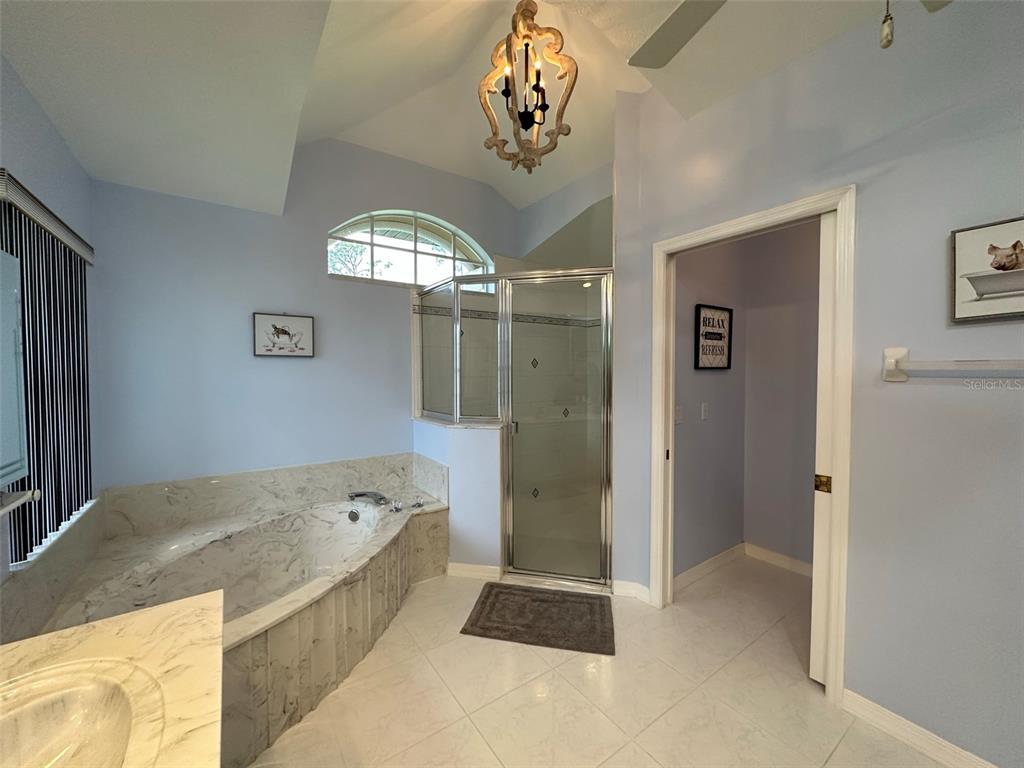 1238 Yorkshire Street Port Charlotte, FL 33952 - Photo 23 of 40 a spacious bathroom with a tub shower and view of bathroom