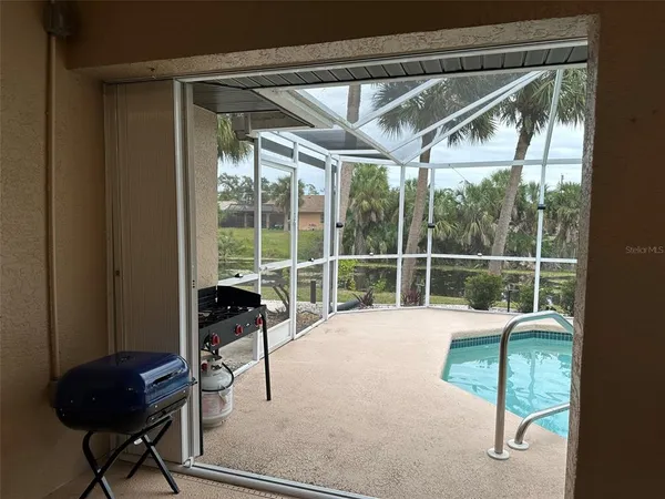 a view of a chair and table in a room