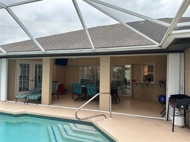 a room with lots of furniture and windows