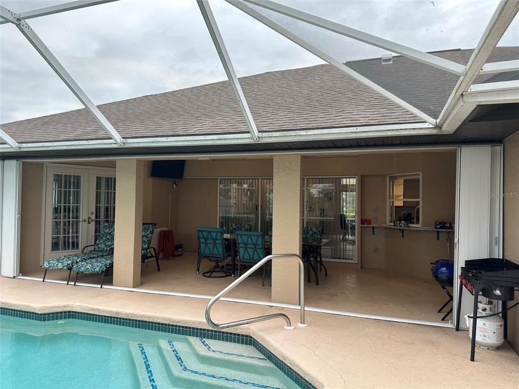 1238 Yorkshire Street Port Charlotte, FL 33952 - Photo 32 of 40 a room with lots of furniture and windows