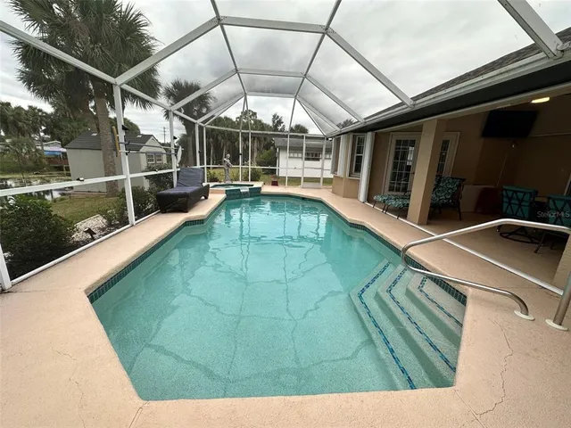 a view of a swimming pool with a porch