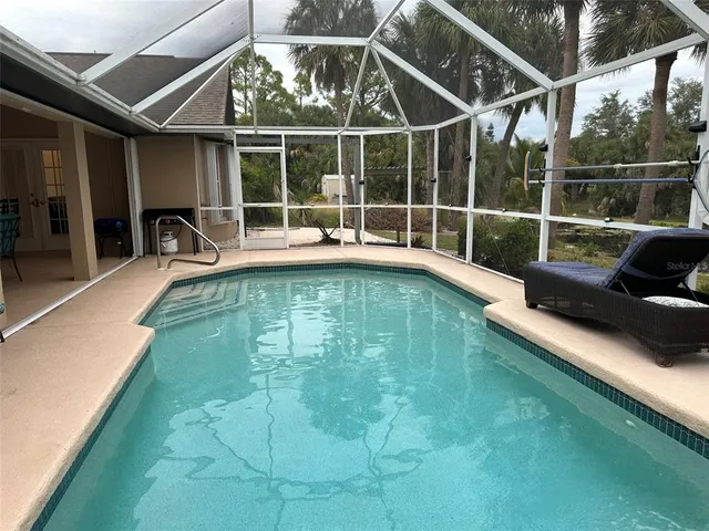 a view of a swimming pool with couches