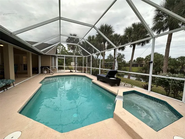 a view of a swimming pool with a porch