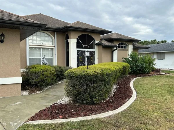 a front view of a house with a yard