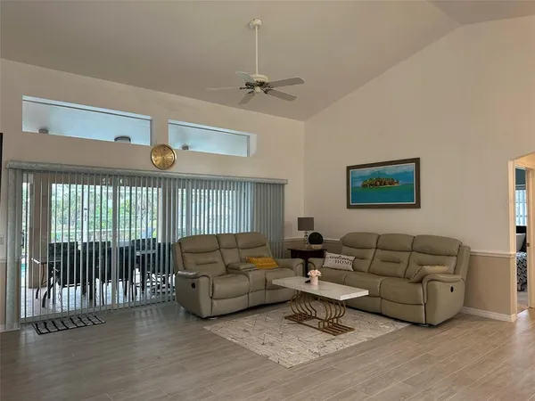 a living room with furniture or couch and a wooden floor