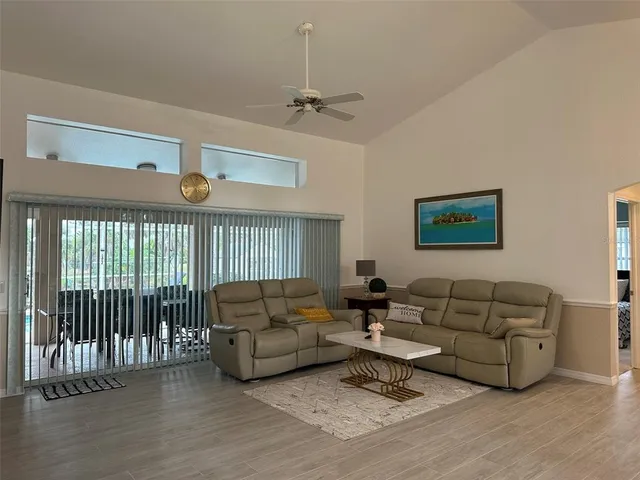 a living room with furniture or couch and a wooden floor