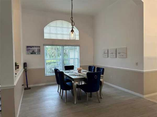 a view of a dining room with furniture window and outside view