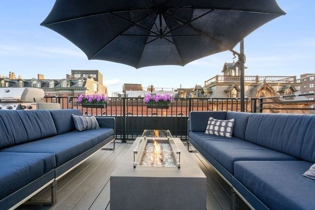 a view of roof deck with seating space