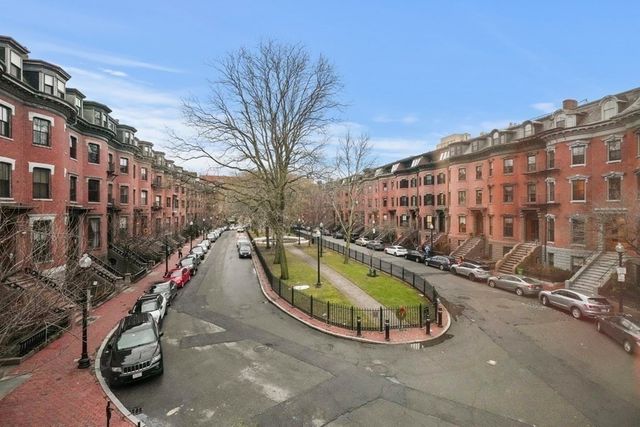 a view of a swimming pool with a lounge chairs