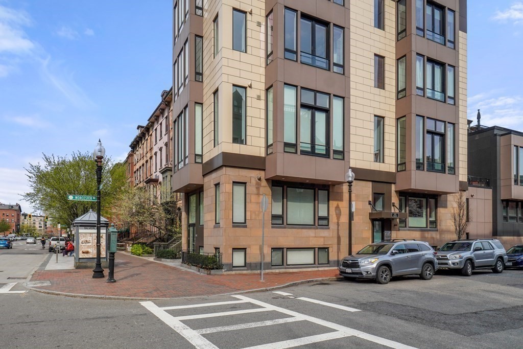 1672 R Washington Street, Unit TH1 Boston, MA 02118 - Photo 38 of 40 a view of a street that has couple of cars parked on the road