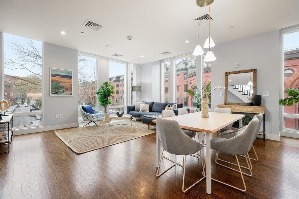 1672 R Washington Street, Unit TH1 Boston, MA 02118 - Photo 5 of 40 a view of a dining room with furniture window and wooden floor