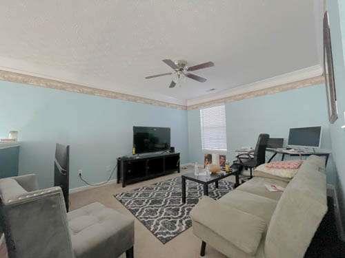 147 Benfield Circle Southeast Cartersville, GA 30121 - Photo 13 of 18 a living room with furniture and a flat screen tv