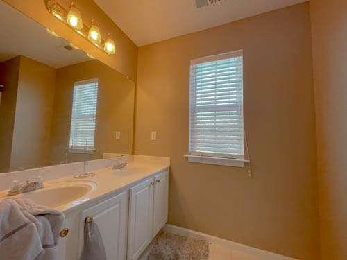 147 Benfield Circle Southeast Cartersville, GA 30121 - Photo 15 of 18 a bathroom with a sink and a mirror