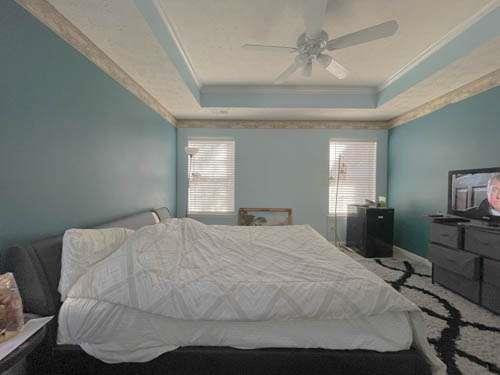 147 Benfield Circle Southeast Cartersville, GA 30121 - Photo 16 of 18 a bedroom with a bed and a television