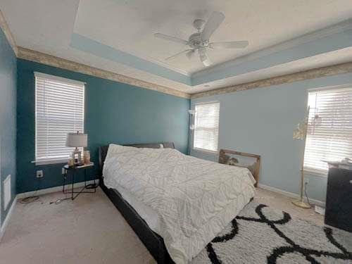 147 Benfield Circle Southeast Cartersville, GA 30121 - Photo 10 of 18 a bedroom with a bed and a window
