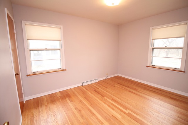 1460 Burr Oak Road Homewood, IL 60430 - Photo 12 of 19 a view of empty room with wooden floor and fan