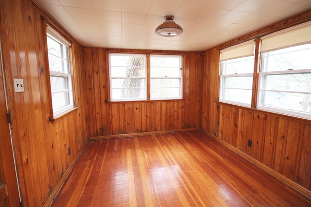 1460 Burr Oak Road Homewood, IL 60430 - Photo 10 of 19 a view of an empty room with wooden floor and a window