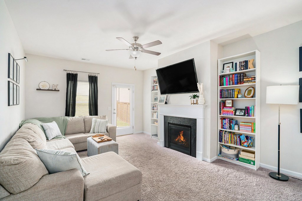 206 Worley Drive Jasper, GA 30143 - Photo 5 of 17 a living room with furniture a fireplace and a flat screen tv