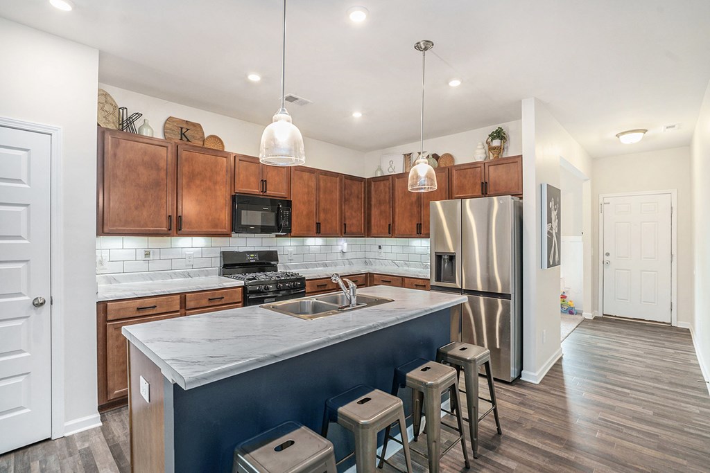 206 Worley Drive Jasper, GA 30143 - Photo 7 of 17 a kitchen with a refrigerator a sink and wooden floor