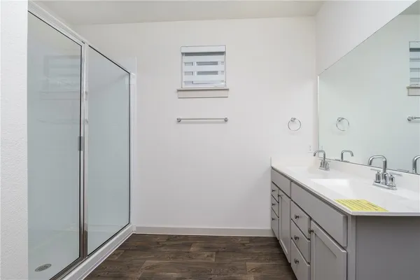 a bathroom with a sink a vanity and a mirror