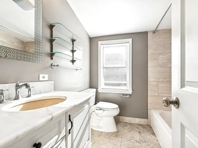 a bathroom with a sink a toilet and a bathtub