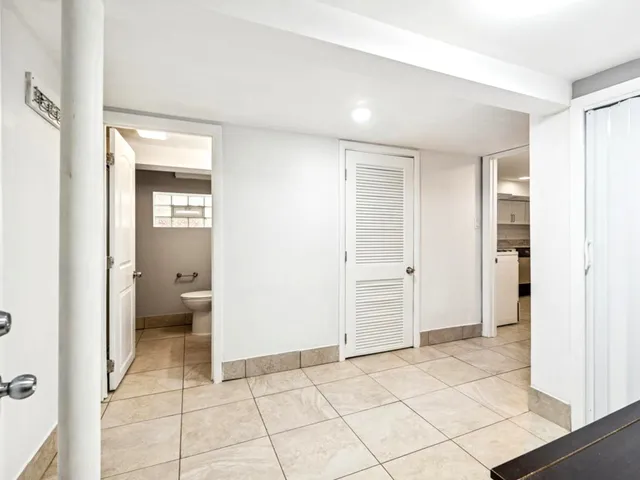 a balcony with chairs and wooden floor