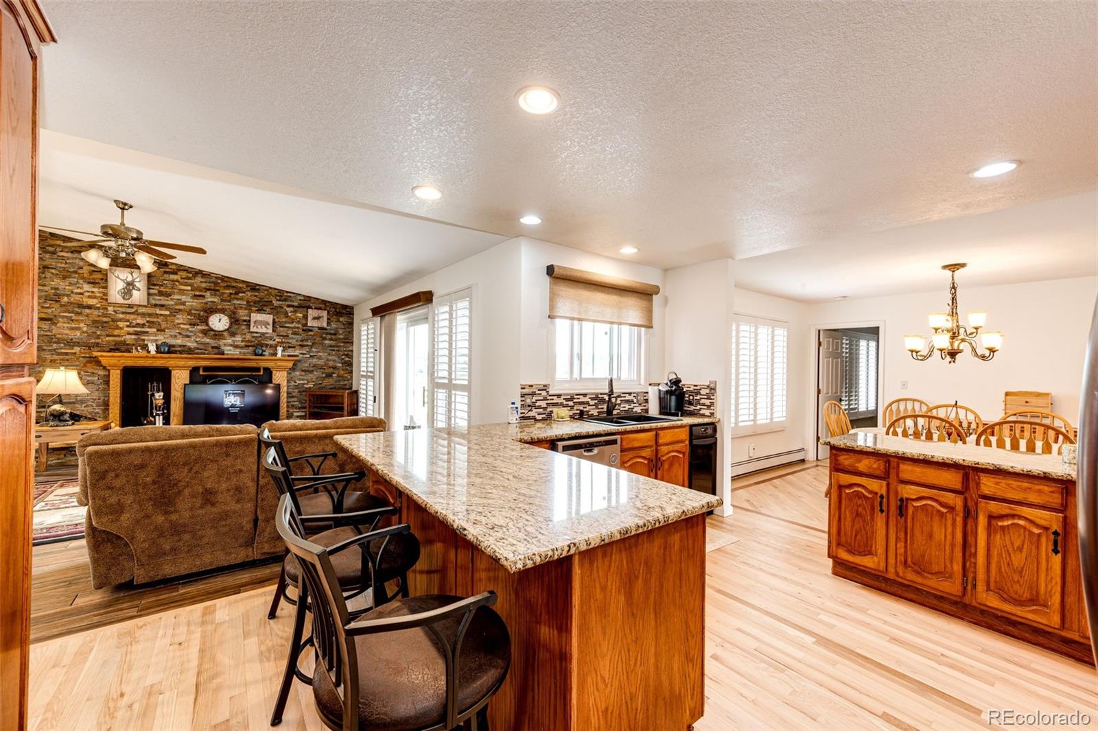 2218 Deerpath Road Franktown, CO 80116 - Photo 15 of 46 a view of a kitchen and dining room