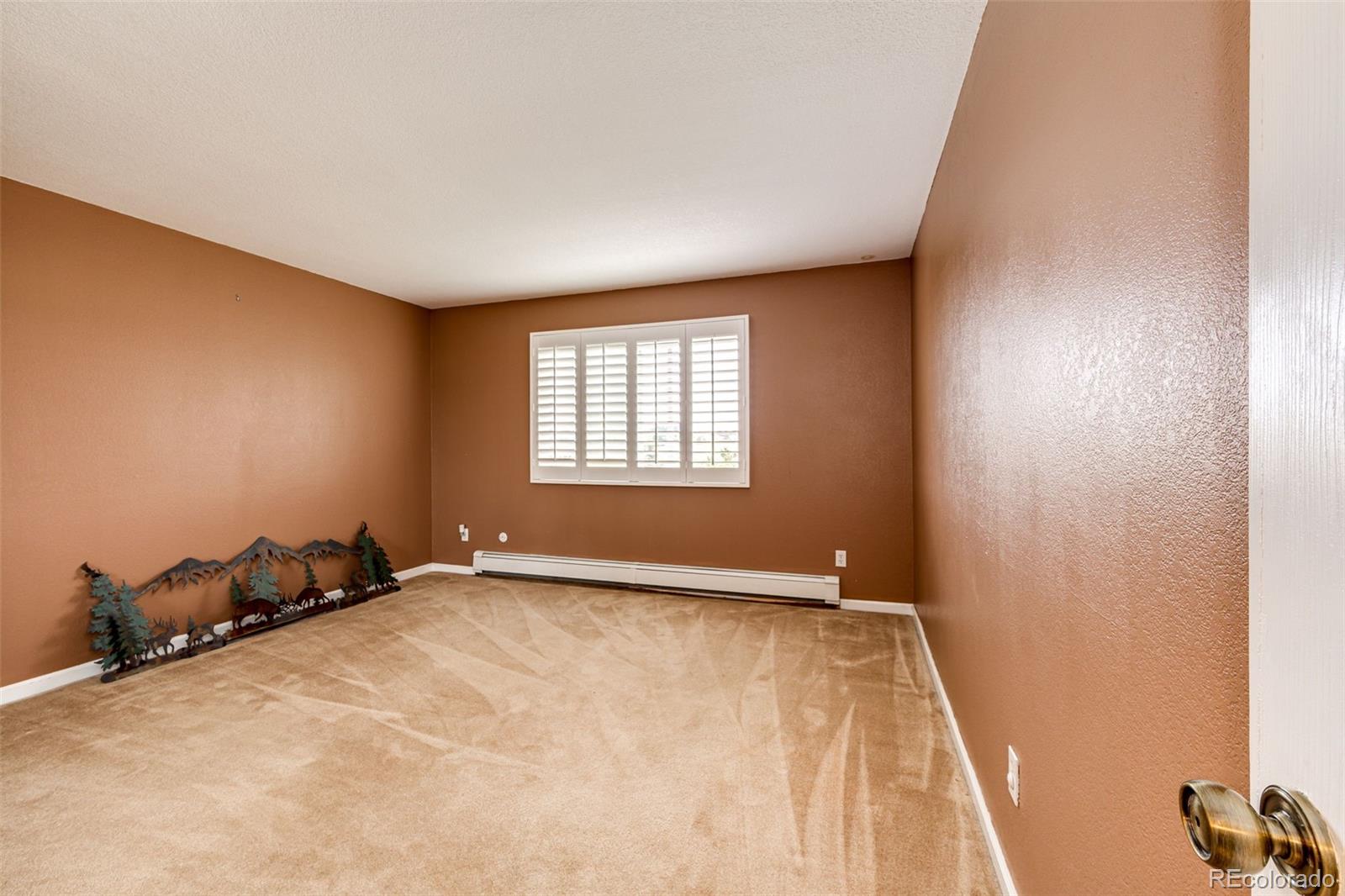2218 Deerpath Road Franktown, CO 80116 - Photo 26 of 46 an empty room with windows