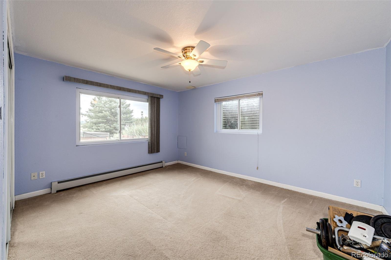 2218 Deerpath Road Franktown, CO 80116 - Photo 29 of 46 an empty room with windows and fan