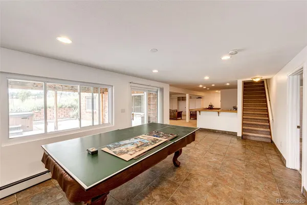 a living room with a table and a wooden floor