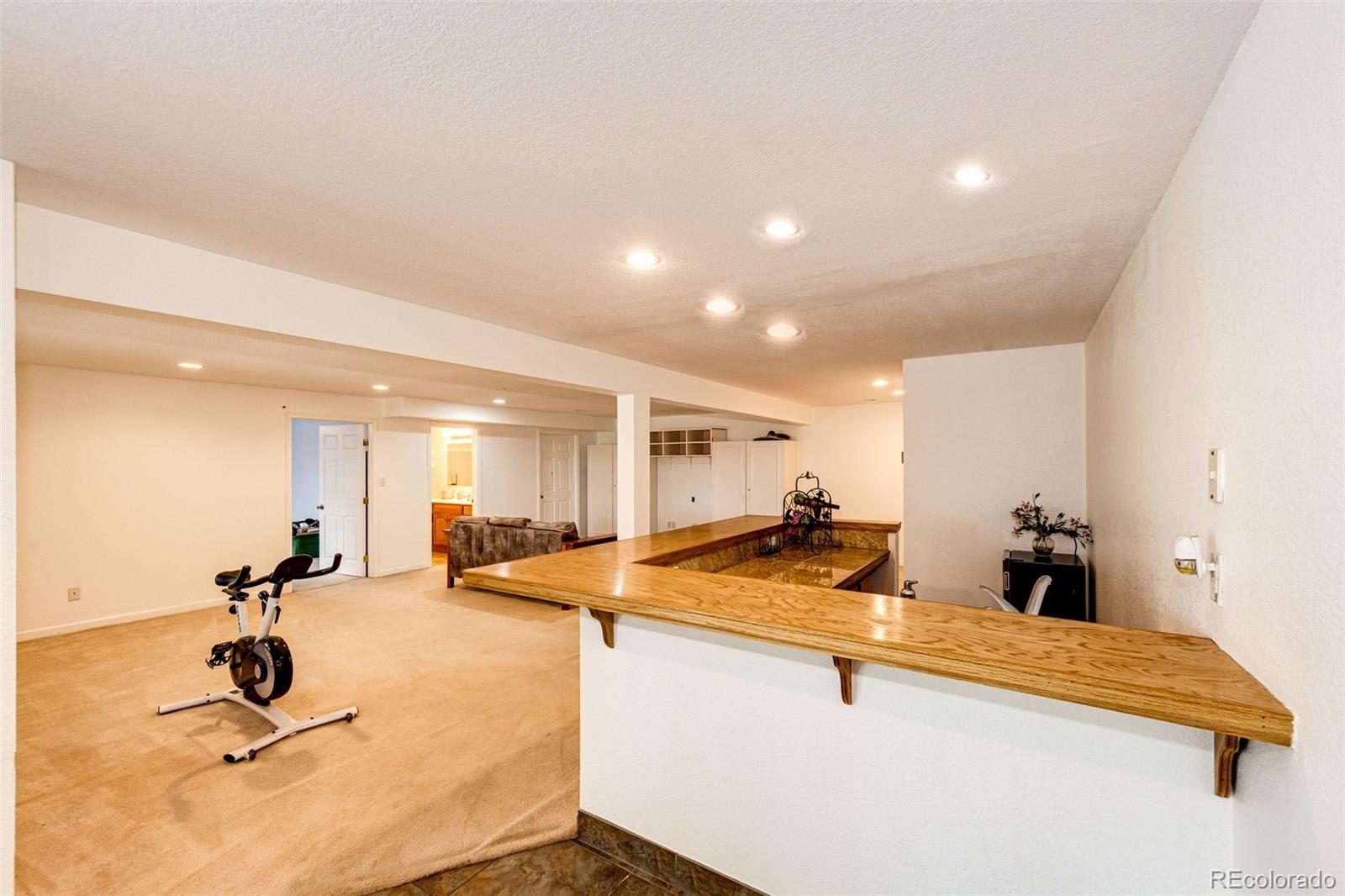 2218 Deerpath Road Franktown, CO 80116 - Photo 35 of 46 a room with lots of chairs and mirrors