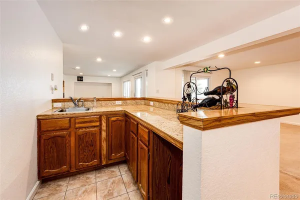 a kitchen with stainless steel appliances granite countertop a sink and cabinets