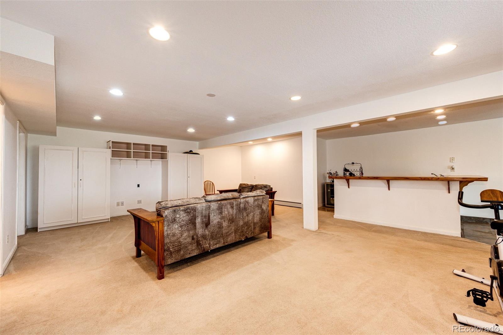 2218 Deerpath Road Franktown, CO 80116 - Photo 38 of 46 a living room with furniture and a table