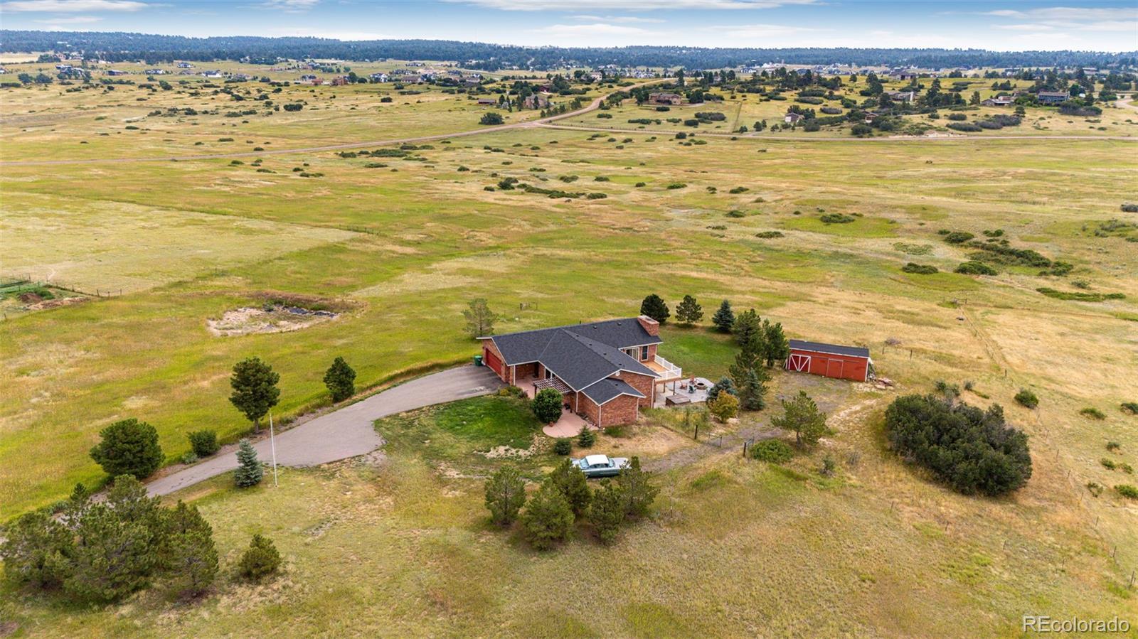 2218 Deerpath Road Franktown, CO 80116 - Photo 43 of 46 a view of an ocean and beach