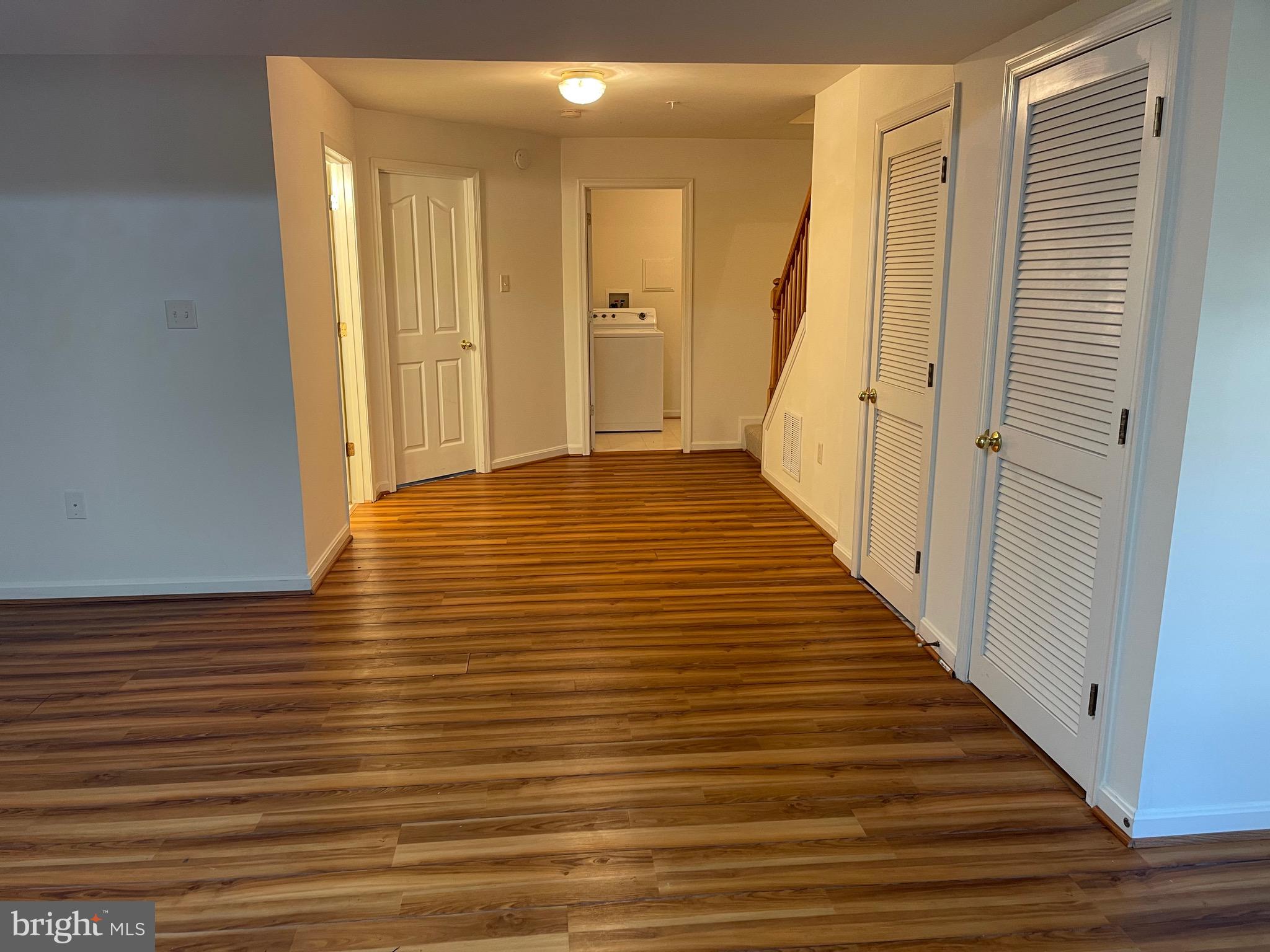 2017 Buell Drive Frederick, MD 21702 - Photo 22 of 23 a view of a hallway with wooden floor and staircase
