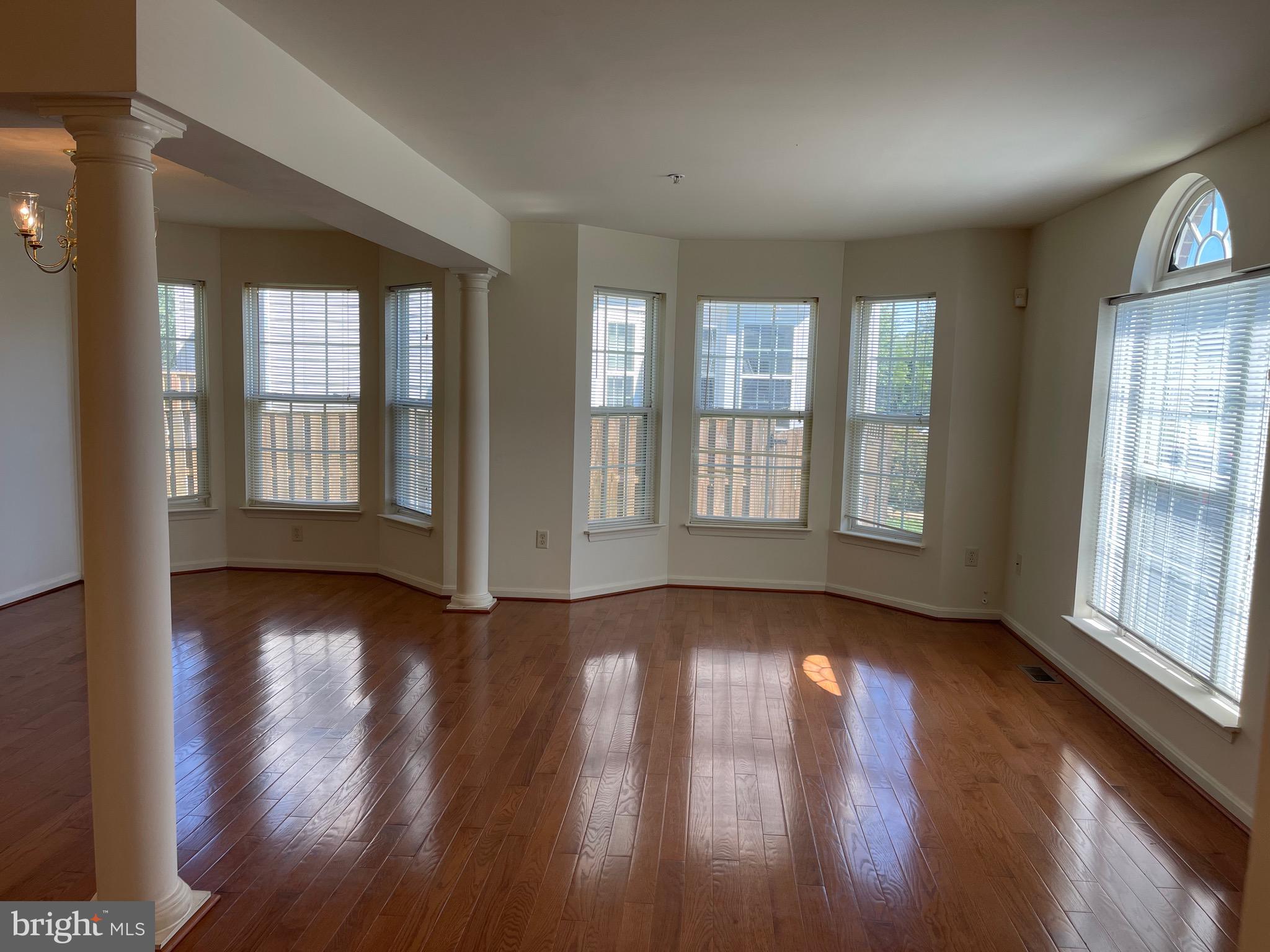 2017 Buell Drive Frederick, MD 21702 - Photo 6 of 23 an empty room with wooden floor and windows