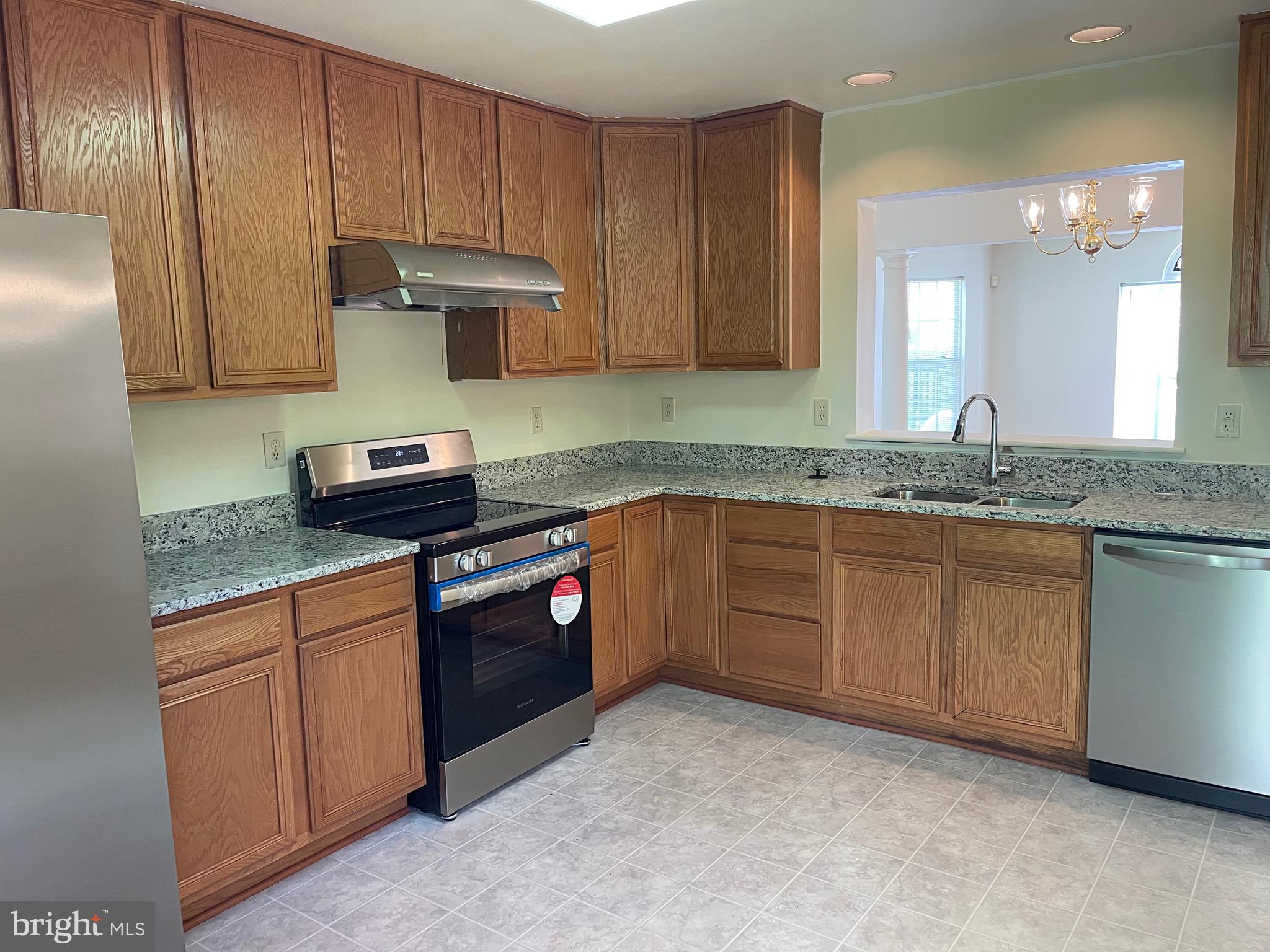 2017 Buell Drive Frederick, MD 21702 - Photo 8 of 23 a kitchen with granite countertop cabinets stainless steel appliances and a sink