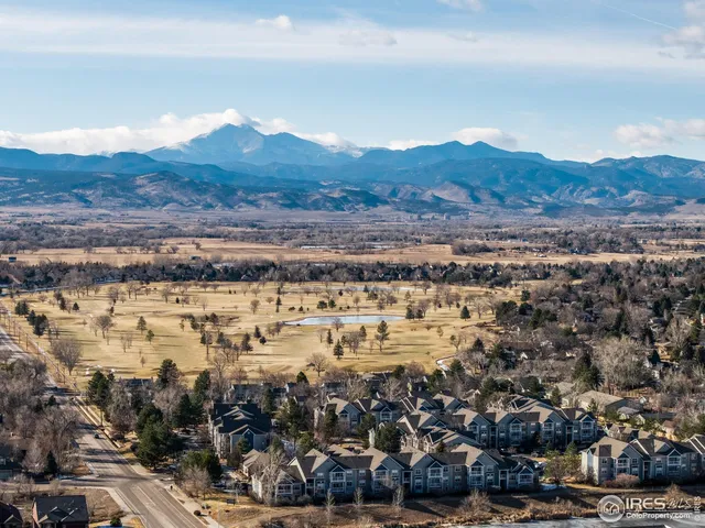 an aerial view of residential house and green space