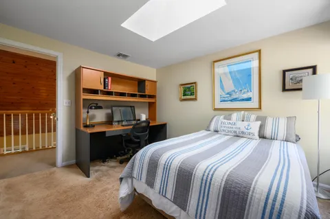 a bedroom with a bed and a cabinets