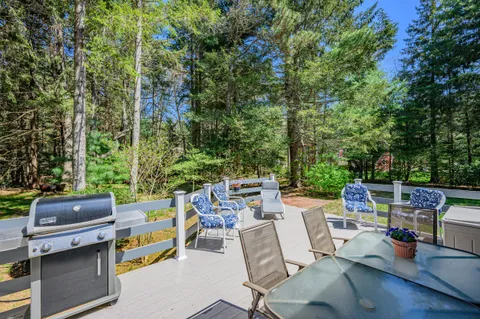 a view of a patio with table and chairs and potted plants