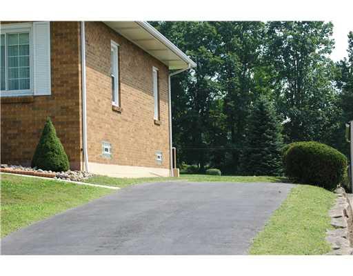 47 Emery Road Fredericktown, PA 15333 - Photo 2 of 12 Exterior Front. Driveway to right of house with room to access rear yard