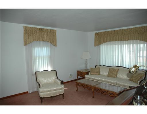 47 Emery Road Fredericktown, PA 15333 - Photo 6 of 12 Living Room. Living room with large picture window facing Emery and tall window overlooking the drive