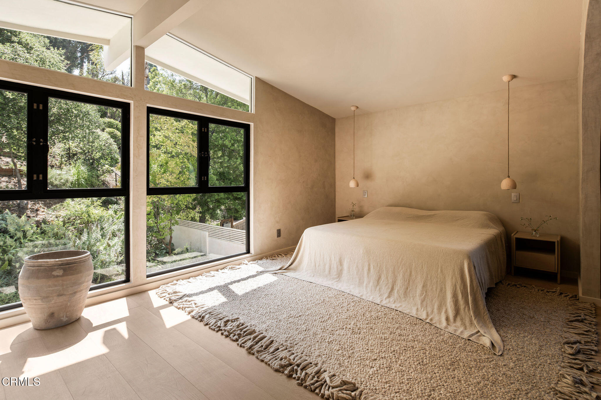 4722 Larkwood Avenue Los Angeles, CA 91364 - Photo 11 of 27 a bedroom with a large bed and a large window