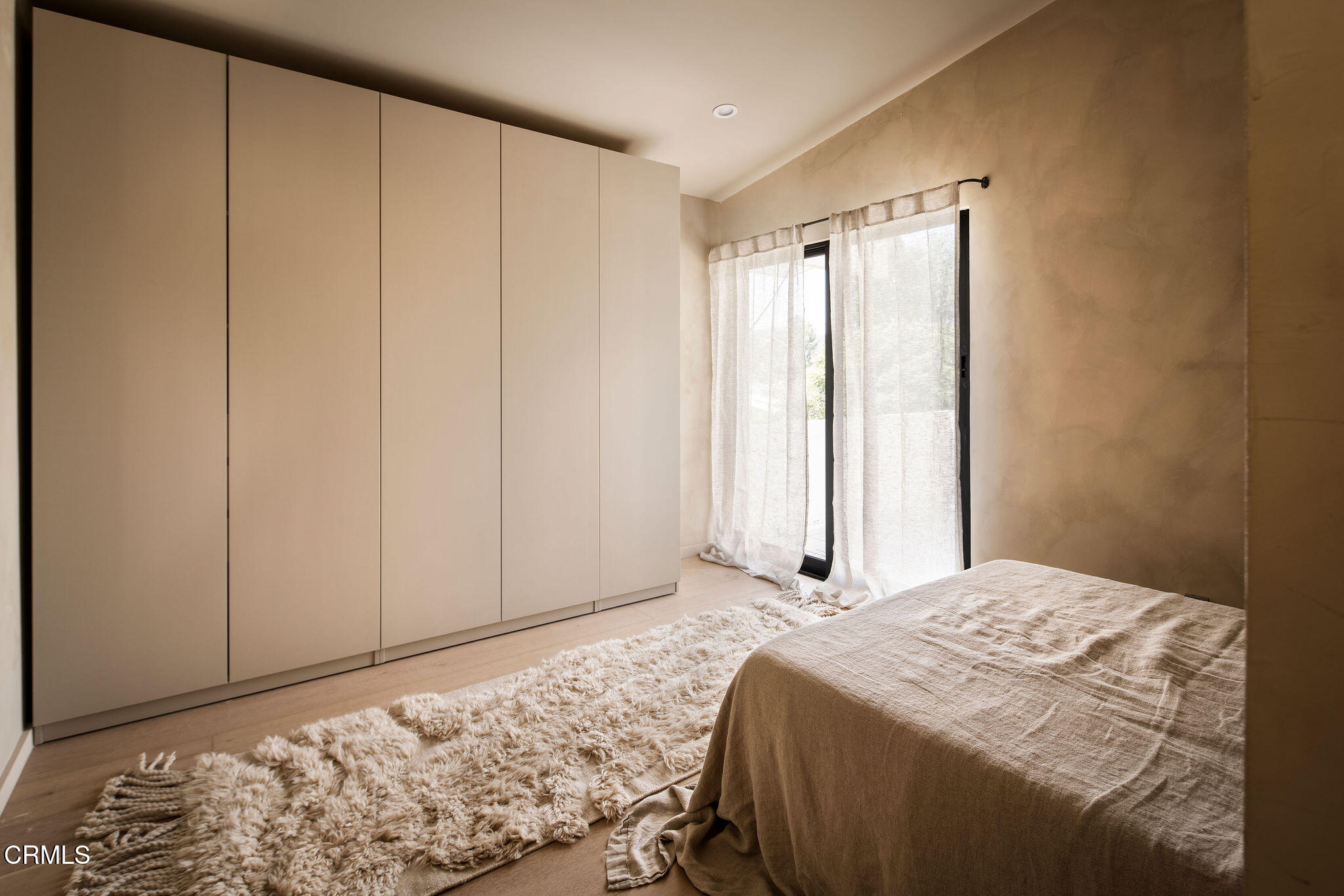 4722 Larkwood Avenue Los Angeles, CA 91364 - Photo 13 of 27 a bedroom with a bed and a window