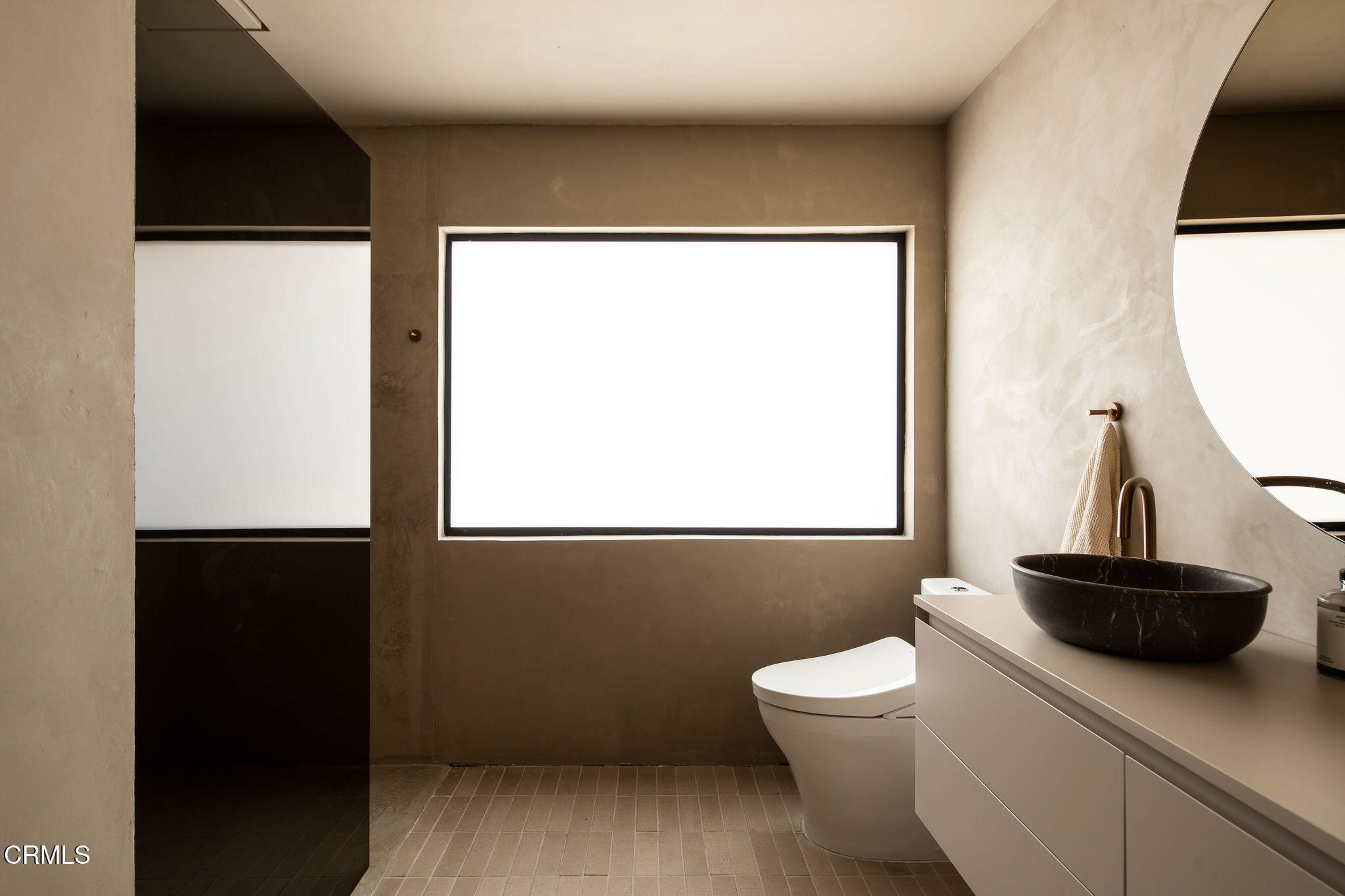4722 Larkwood Avenue Los Angeles, CA 91364 - Photo 14 of 27 a bathroom with a toilet a sink and a mirror